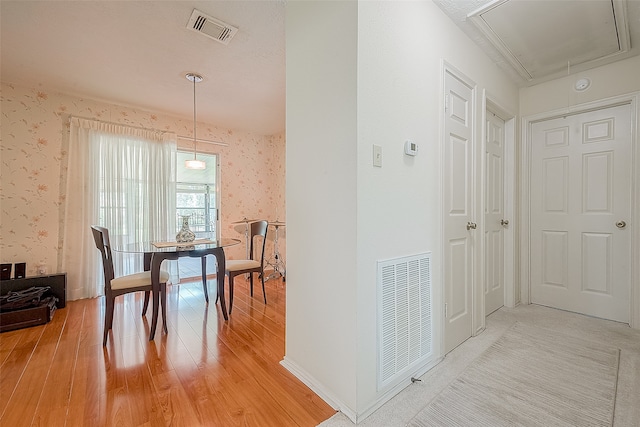 hallway with hardwood / wood-style flooring