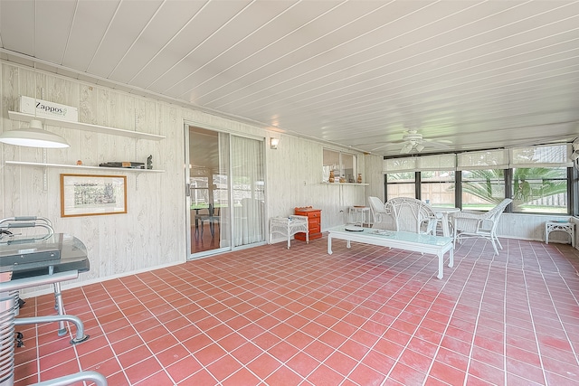 unfurnished sunroom with wood ceiling and ceiling fan