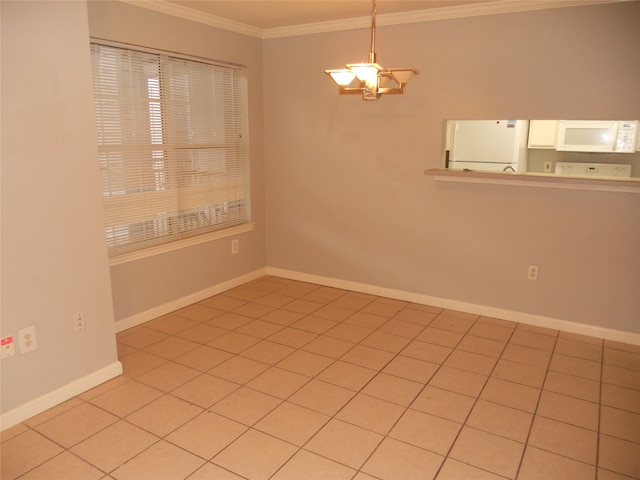 tiled empty room featuring crown molding