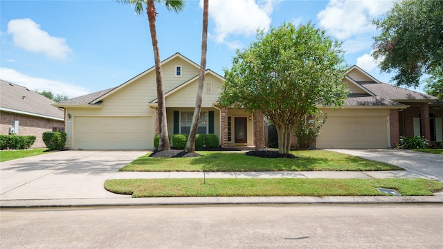 view of front of property featuring a garage and a front lawn