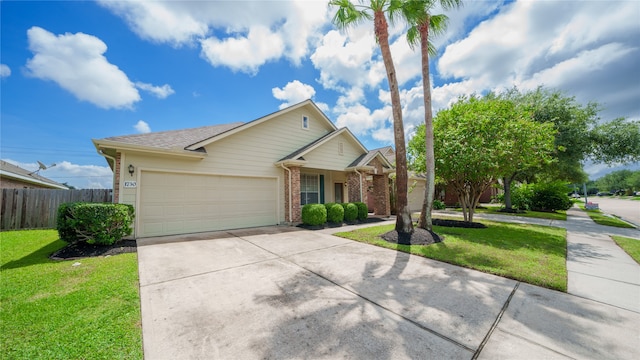 view of front of home featuring a front lawn and a garage