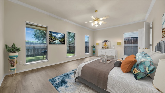 bedroom with crown molding, ceiling fan, and light wood-type flooring