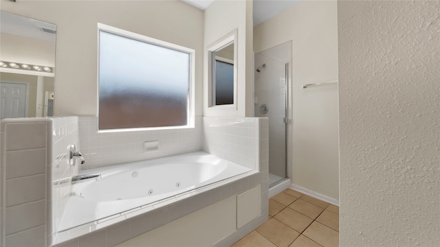 bathroom featuring independent shower and bath and tile patterned flooring