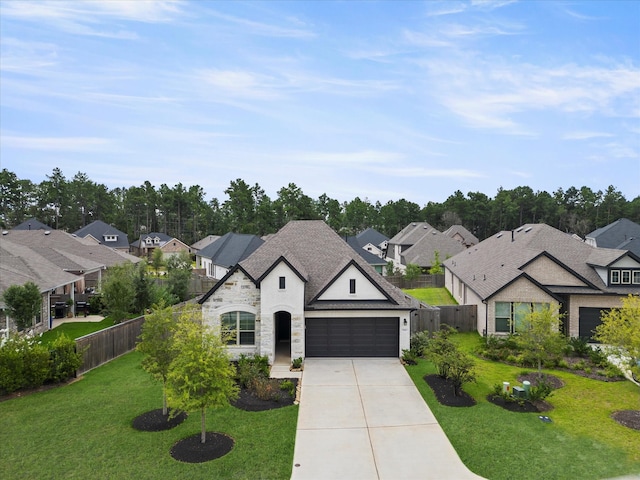 french country home with a garage and a front lawn