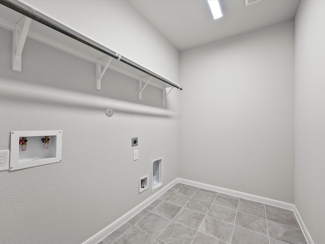 laundry room with hookup for a washing machine, gas dryer hookup, light tile patterned flooring, and electric dryer hookup