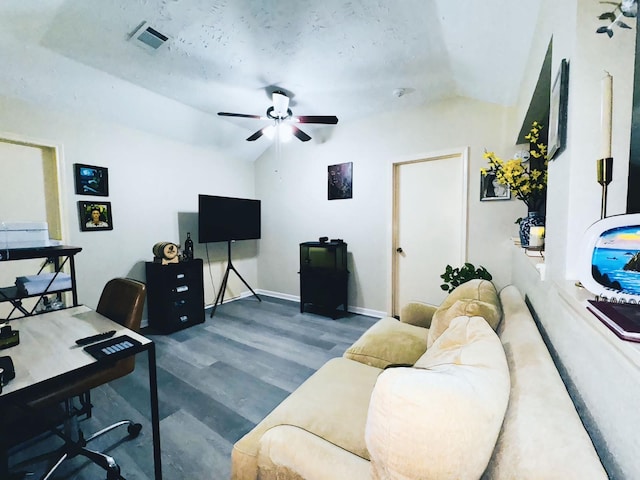 office featuring vaulted ceiling, wood-type flooring, and ceiling fan