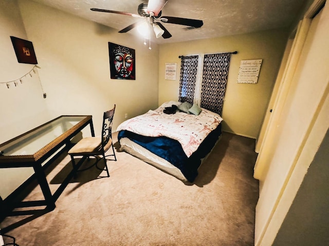 bedroom with ceiling fan and carpet floors