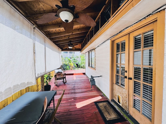 wooden terrace featuring ceiling fan