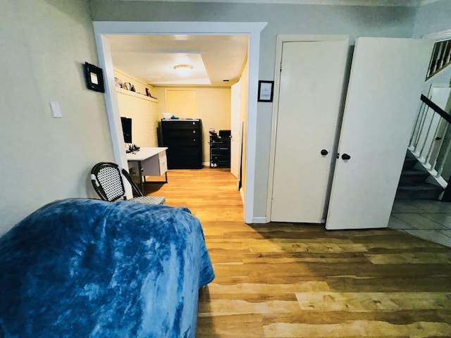 bedroom featuring light wood-type flooring and a closet