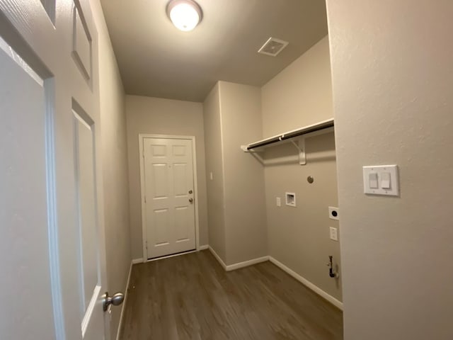 laundry room with hookup for an electric dryer, washer hookup, gas dryer hookup, and dark wood-type flooring