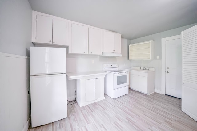 kitchen with light wood-type flooring, white appliances, and white cabinetry