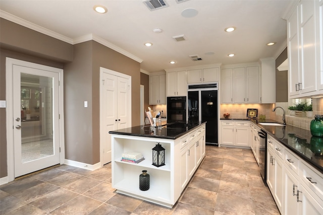 kitchen featuring crown molding, white cabinetry, sink, black appliances, and tasteful backsplash