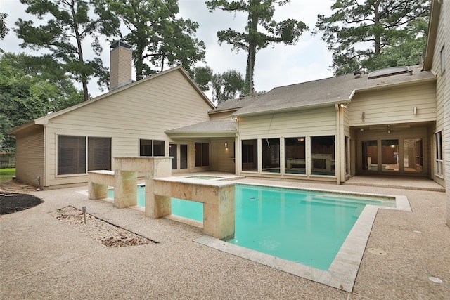 view of pool featuring a patio