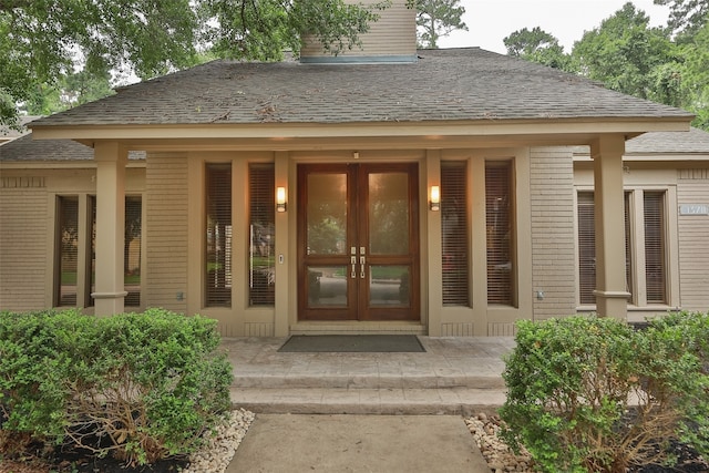 view of exterior entry featuring french doors