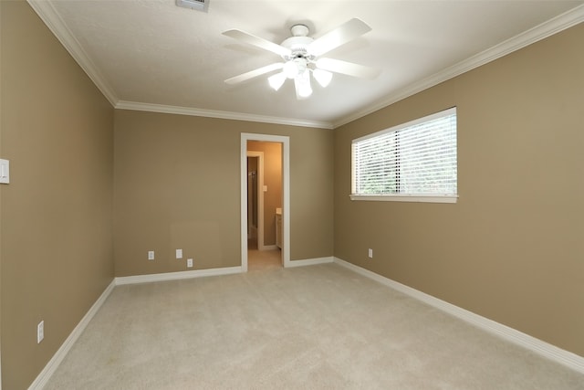 interior space featuring light carpet, ornamental molding, and ceiling fan