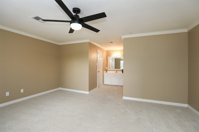 interior space featuring ceiling fan, ornamental molding, light carpet, and ensuite bathroom