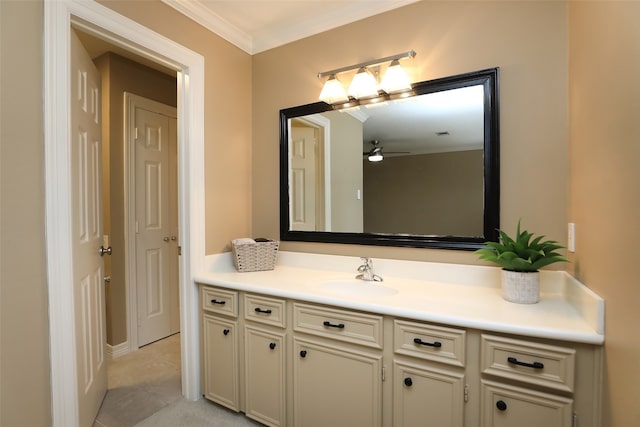 bathroom with ornamental molding, vanity, ceiling fan, and tile patterned flooring