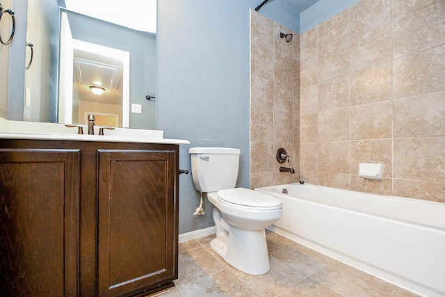 full bathroom featuring tiled shower / bath combo, vanity, toilet, and tile patterned flooring