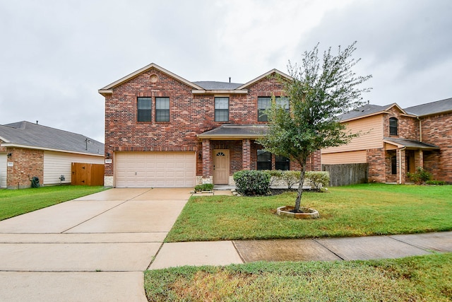 view of front of property with a garage and a front lawn