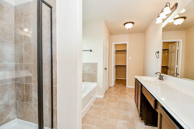 bathroom featuring tile patterned floors, shower with separate bathtub, a notable chandelier, and vanity