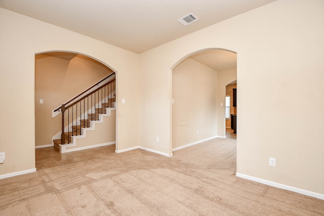 spare room with light carpet