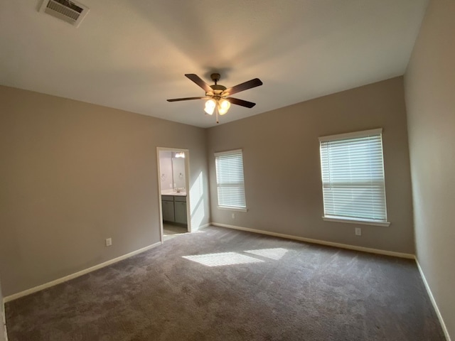 empty room featuring light carpet and ceiling fan