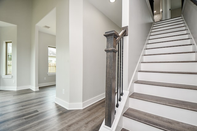 stairway with hardwood / wood-style flooring