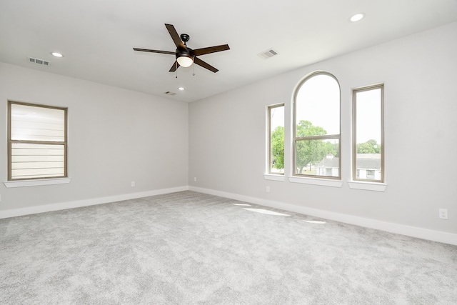 carpeted empty room with ceiling fan