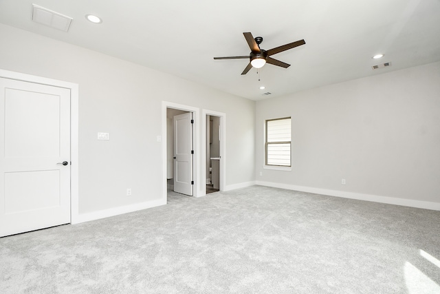 unfurnished bedroom featuring light colored carpet and ceiling fan