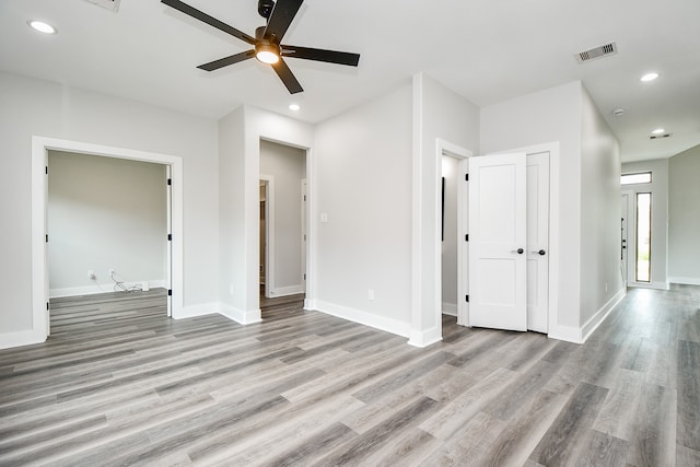 spare room with light hardwood / wood-style flooring and ceiling fan