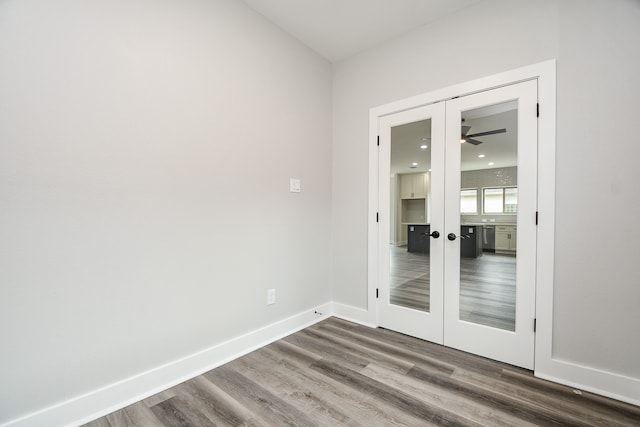 unfurnished room with french doors, wood-type flooring, and ceiling fan