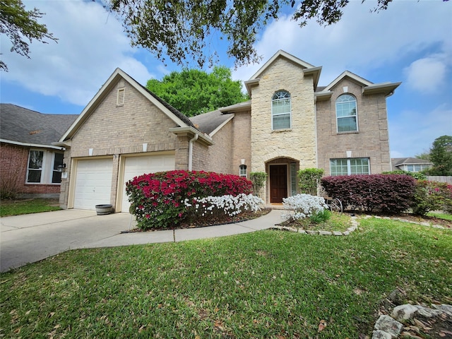 view of front property with a garage and a front yard