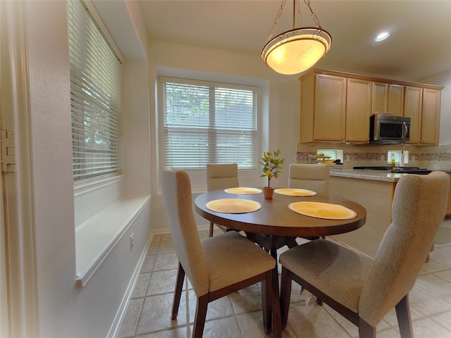 dining room with light tile patterned floors