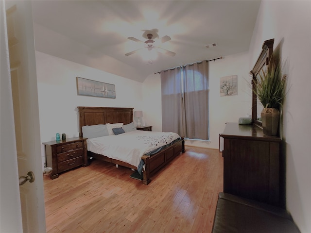 bedroom with ceiling fan and light hardwood / wood-style flooring