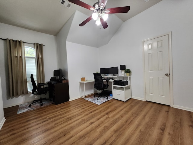 home office with vaulted ceiling, hardwood / wood-style floors, and ceiling fan