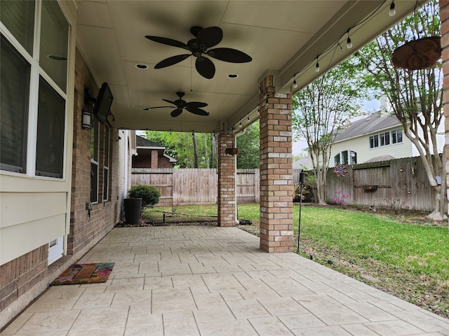 view of patio featuring ceiling fan