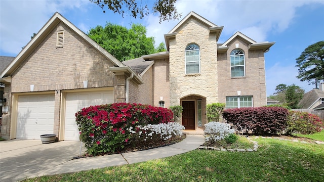 view of front property featuring a front yard and a garage