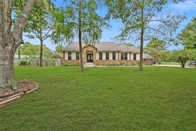 ranch-style house with a front lawn