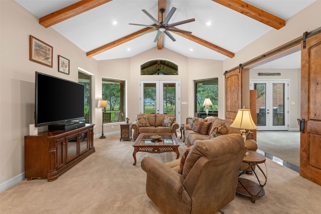 living room with plenty of natural light, light colored carpet, and french doors