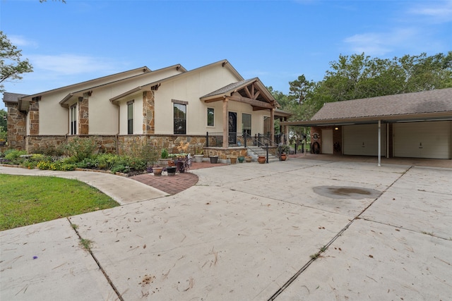 view of front of property with an outdoor structure and a garage