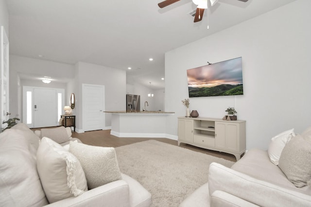 living room with light wood-type flooring and sink