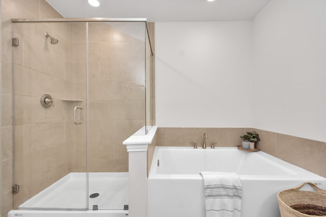 bathroom featuring plus walk in shower