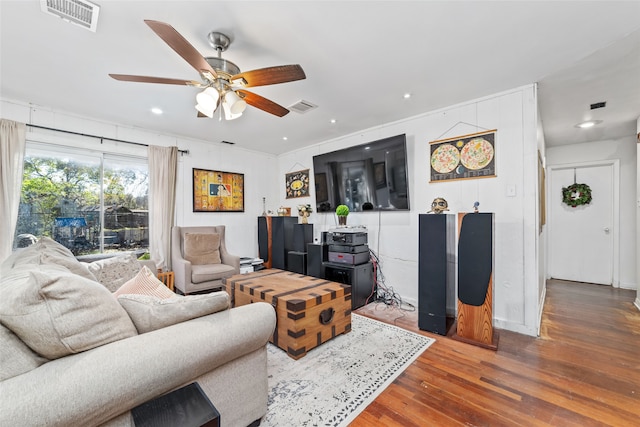 living room featuring ceiling fan and hardwood / wood-style floors