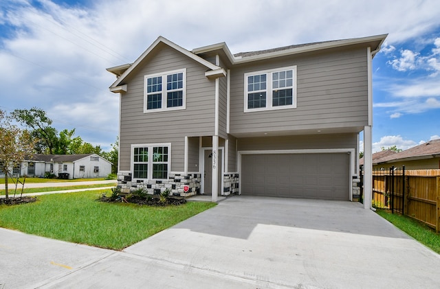 view of front of house featuring a front yard and a garage