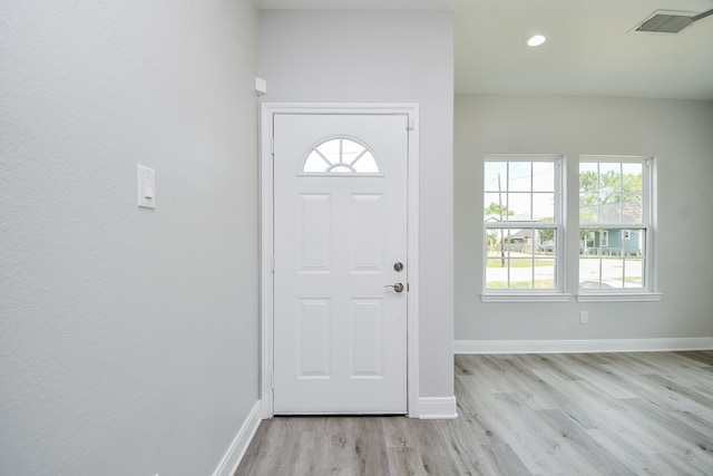 foyer entrance with light wood-type flooring