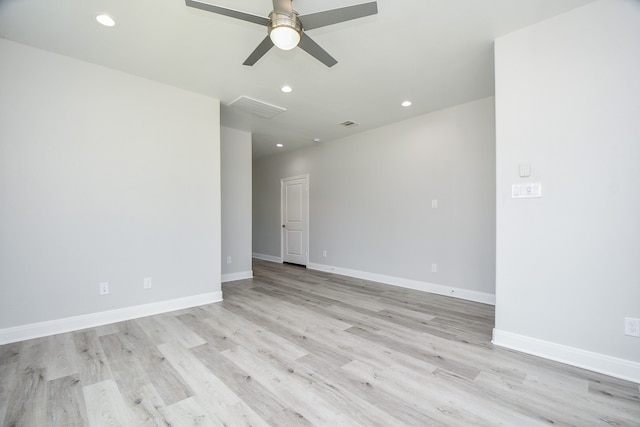 empty room with ceiling fan and light wood-type flooring