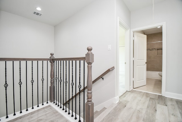 stairway featuring hardwood / wood-style flooring