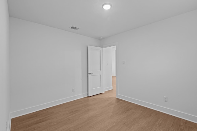 spare room with light hardwood / wood-style floors