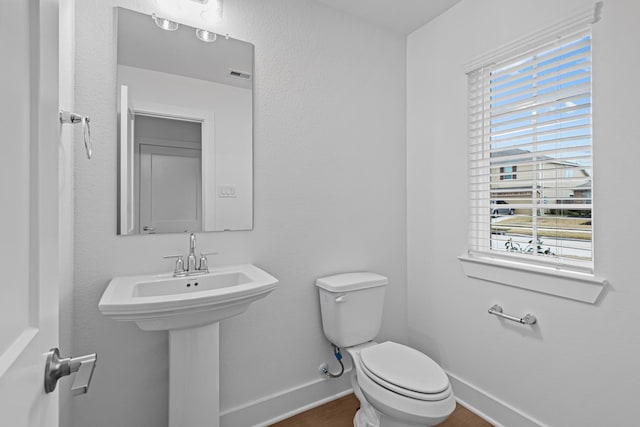 bathroom with sink and toilet