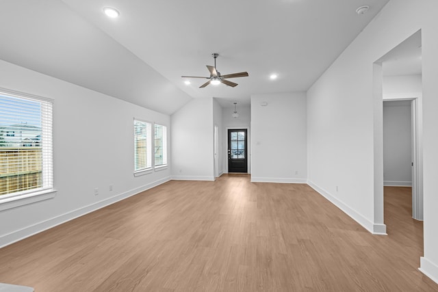 unfurnished room with ceiling fan, lofted ceiling, and light hardwood / wood-style floors